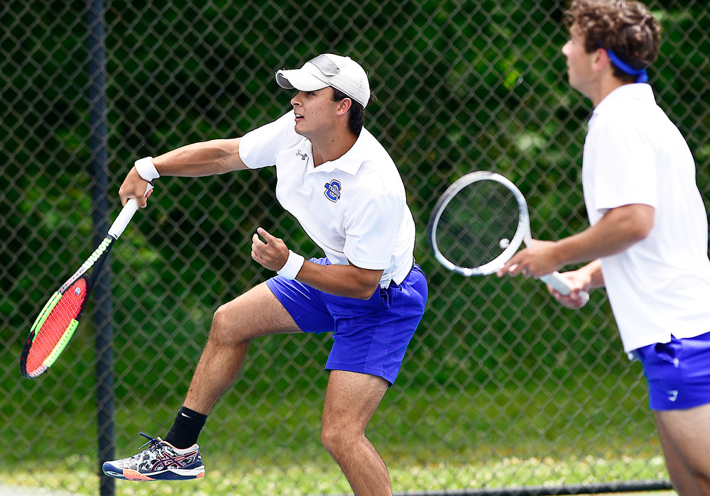 Staff Photo by Robin Rudd / From left, Cleveland's Brayden Conn slams a overhead, while teammate Bryce Elliott looks on, during their match with Science Hill's Om Patel and Daniel Haddadin. TSSAA Spring Fling tennis continued at the Adams Tennis Complex in Murfreesboro on May 27, 2021.