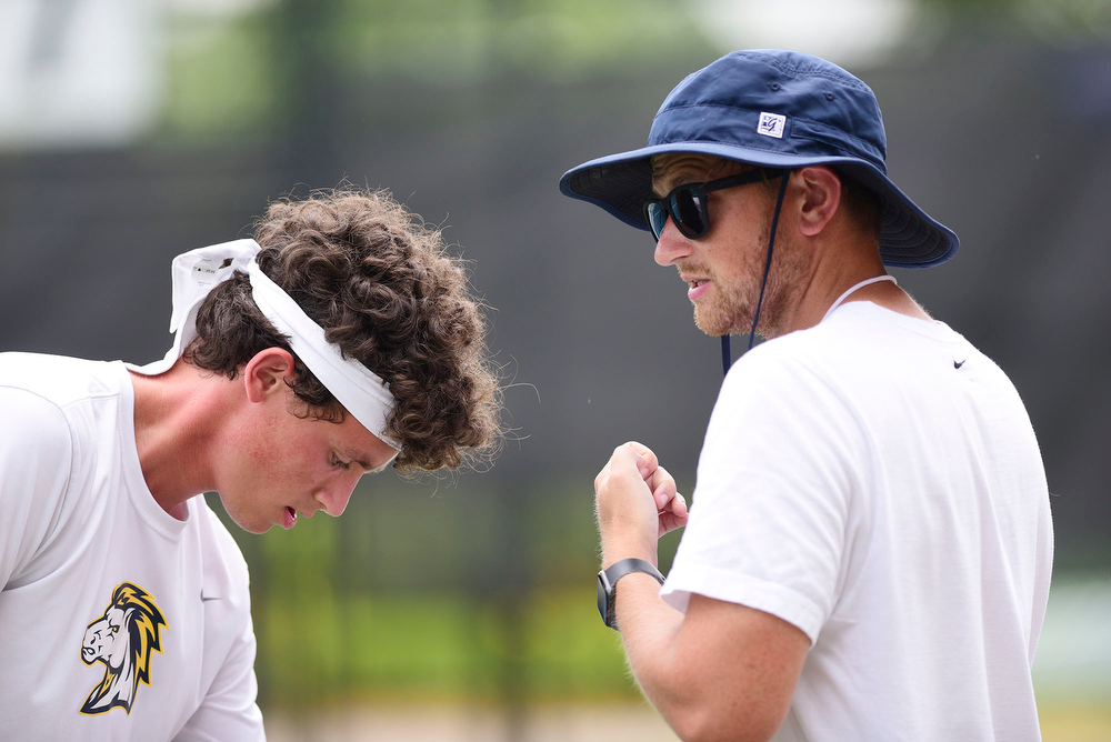 Staff Photo by Robin Rudd / Walker Valley tennis coach Jordan Willcutt, right, talks with Jacob Johnson between games. TSSAA Spring Fling tennis at the Adams Tennis Complex in Murfreesboro on May 27, 2021.