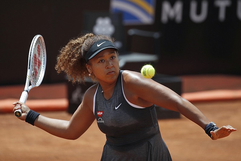 Naomi Osaka of Japan returns the ball to Jessica Pegula of the United States during their match at the Italian Open tennis tournament, in Rome, Wednesday, May 12, 2021. Osaka lost against Pegula 7-6, 6-2. (AP Photo/Alessandra Tarantino)