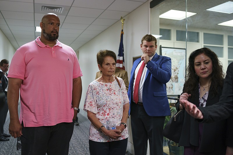 Gladys Sicknick, center, mother of Brian Sicknick, the Capitol Police officer who died from injuries sustained during the Jan. 6 mob attack on Congress, leaves a meeting with Republican Sen. Ron Johnson of Wisconsin after advocating for creation of an independent commission to investigate the assault, at the Capitol in Washington, Thursday, May 27, 2021. She is escorted by Harry Dunn, left, a U.S. Capitol Police officer who faced the rioters on Jan. 6. (AP Photo/J. Scott Applewhite)


