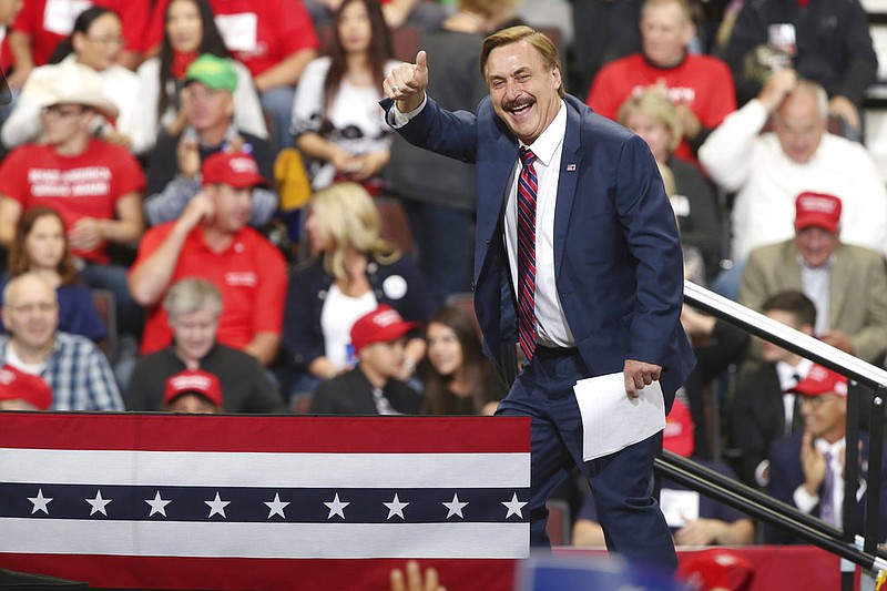 Mike Lindell, inventor and founder of My Pillow, gives a thumbs up before a rally address by President Donald Trump Thursday, Oct. 4, 2018, in Rochester, Minn. (AP Photo/Jim Mone)