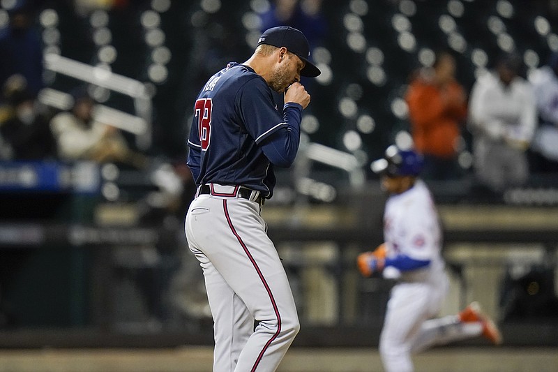 AP photo by Frank Franklin II / Atlanta Braves reliever Jay Flaa, center, gave up a two-run homer to the New York Mets' Francisco Lindor, right, during the seventh inning of Saturday night's game in New York.