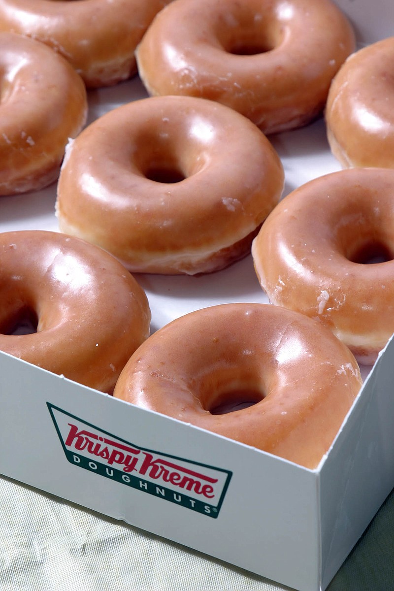 AP Photo/Nell Redmond / Krispy Kreme sells its treats in grocery and convenience stores in the United States and operates shops in 30 countries.