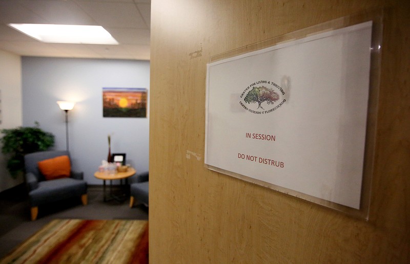 Staff photo by Erin O. Smith / A sign is attached to the outside of a counseling room to let others know the room is in use at the Family Justice Center Wednesday, July 3, 2019 in Chattanooga, Tennessee. The center provides help to victims of abuse.