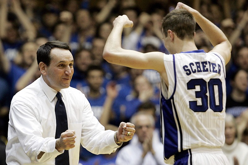 AP photo by Gerry Broome / Duke men's basketball coach Mike Krzyzewski congratulates Jon Scheyer during a home game against Wake Forest on Feb. 22, 2009. Scheyer, who played for the Blue Devils from 2006-10 and joined the coaching staff in 2013, will take over next year when Krzyzewski retires after one final season in charge.