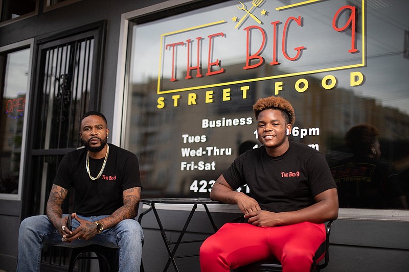Staff photo by Troy Stolt / D'Von Maples Sr. and his son D'Von Jr. pose for a portrait outside of Big 9 Street Food, located at 611 E Martin Luther King Blvd. on Wednesday, June 2, 2021 in Chattanooga, Tenn.