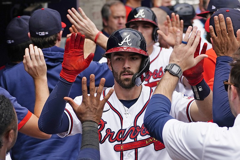 AP photo by John Bazemore / Atlanta Braves shortstop Dansby Swanson celebrates with teammates after hitting a two-run homer in the sixth inning of Thursday afternoon's home game against the Washington Nationals. Swanson homered for the second straight game, and Atlanta won 5-1 to split the four-game series at Truist Park.