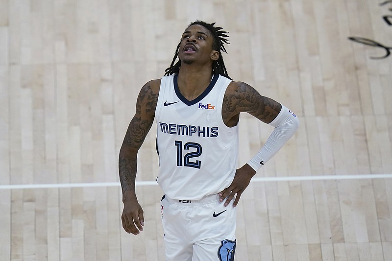 AP photo by Rick Bowmer / Memphis Grizzlies guard Ja Morant looks at the scoreboard as he walks upcourt during Wednesday night's game against the Utah Jazz in Salt Lake City. The Jazz won 126-110 to take the best-of-seven series in the first round of the NBA playoffs in five games.