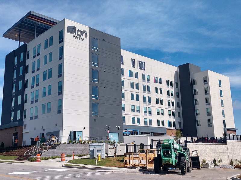 Staff photo by Mike Pare / Workers are putting finishing touches on the Aloft hotel slated to open this month adjacent to Hamilton Place mall. The hotel will feature a rooftop bar.