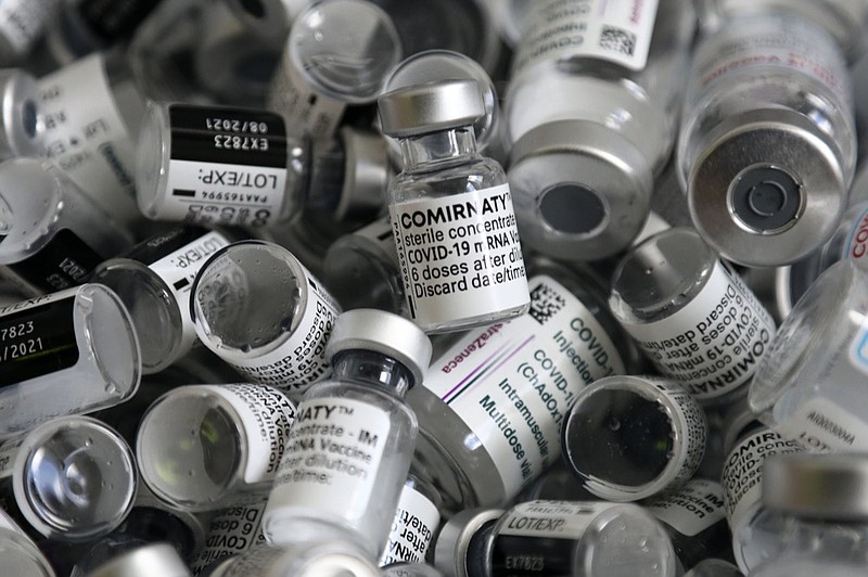 FILE - In this Saturday, May 15, 2021, file photo, empty vials of the Pfizer COVID-19 vaccine lie in a box during a vaccine campaign in Ebersberg near Munich, Germany. (AP Photo/Matthias Schrader, File)


