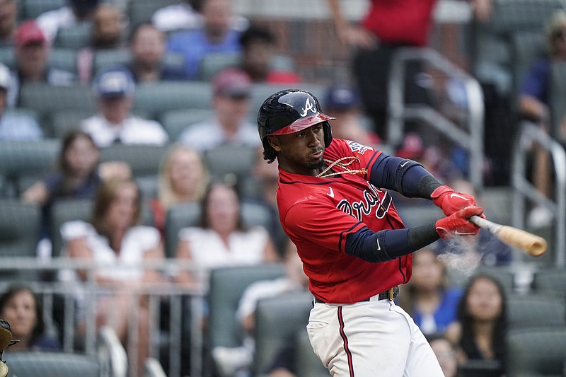 AP photo by Brynn Anderson / The Atlanta Braves' Ozzie Albies singles during the first inning of Friday night's home game against the Los Angeles Dodgers.