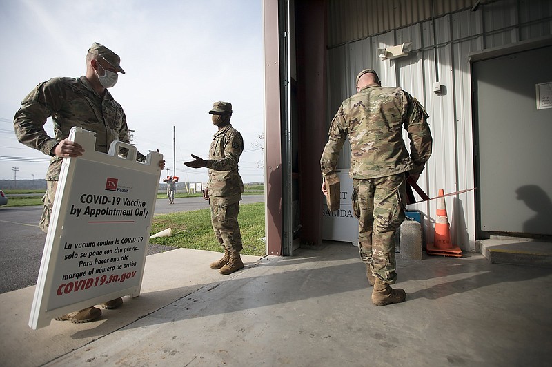 Staff photo by Troy Stolt / Members of the Tennessee National Guard close up the vaccination area at the Meigs County Emergency Management Agency headquarters on Tuesday, March 30, 2021. Meigs County is the most vaccinated county in the Chattanooga region per capita, with nearly 50% of the population having received at least one dose.