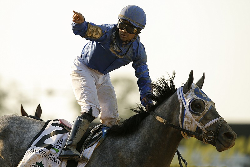 AP photo by Eduardo Munoz Alvarez / Essential Quality jockey Luis Saez celebrates after riding the Brad Cox-trained horse to victory in the 153rd running of the Belmont Stakes on Saturday in Elmont, N.Y.