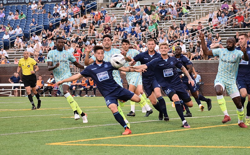 Staff photo by Patrick MacCoon / Chattanooga Football Club's Cameron Woodfin clears a corner kick during the first half of Saturday's NISA match against New Amsterdam FC at Finley Stadium.