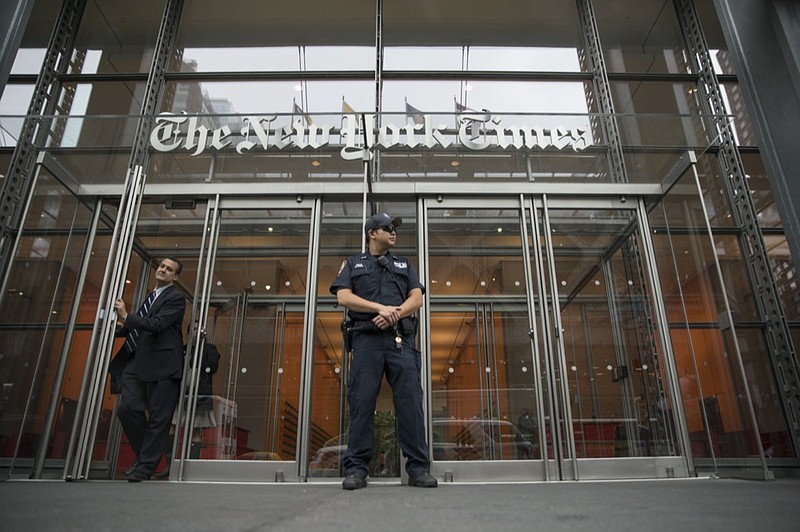 FILE - In this June 28, 2018, file photo, a police officer stands outside The New York Times building in New York. (AP Photo/Mary Altaffer, File)


