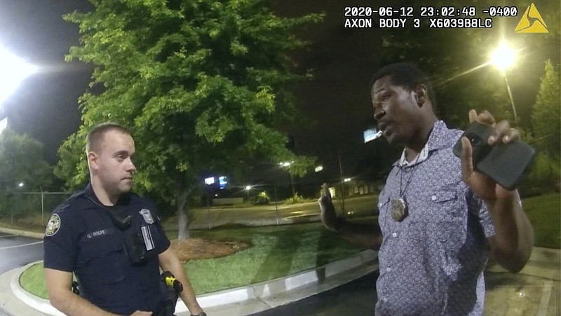 FILE - In this June 12, 2020, file photo from a screen grab taken from body camera video provided by the Atlanta Police Department Rayshard Brooks, right, speaks with Officer Garrett Rolfe, left, in the parking lot of a Wendy's restaurant, in Atlanta. (Atlanta Police Department via AP, File)


