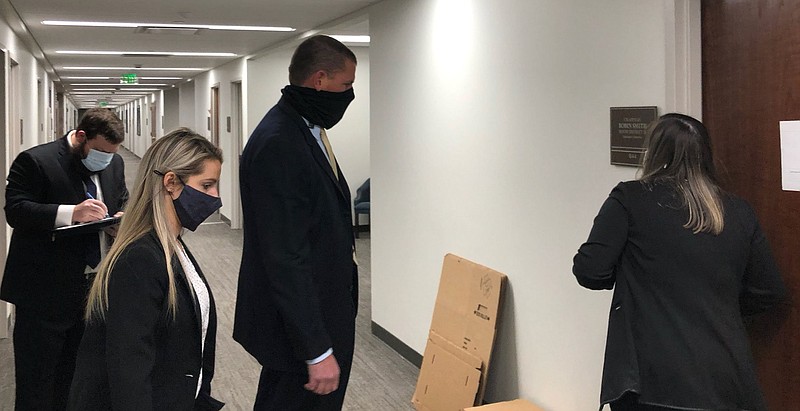 Staff photo by Andy Sher / Federal agents outside the office door of Rep. Robin Smith, R-Hixson, in January 2021.