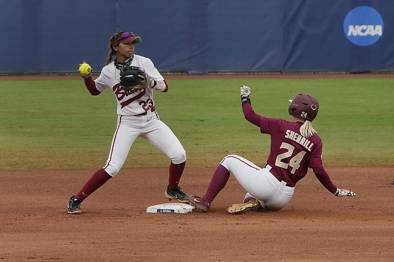 AP photo by Sue Ogrocki / Alabama's Savannah Woodard, left, forces out Florida State's Sydney Sherrill at second base in the first inning of their Women's College World Series game Sunday in Oklahoma City.