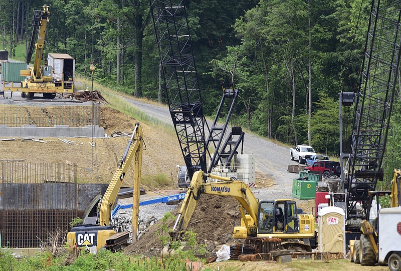 Staff Photo by Robin Rudd / Contractor Charles Blalock and Sons, Inc. contiunes on the State Route-40 (US-64) bridge over the Ocoee River on June 4, 2021. The contractor is working on foundations for the new bridge and relocation of utilities Brief intermittent lane closures are possible Monday through Friday 8 AM to 5:30 PM to allow for utility work and moving equipment/supplies.