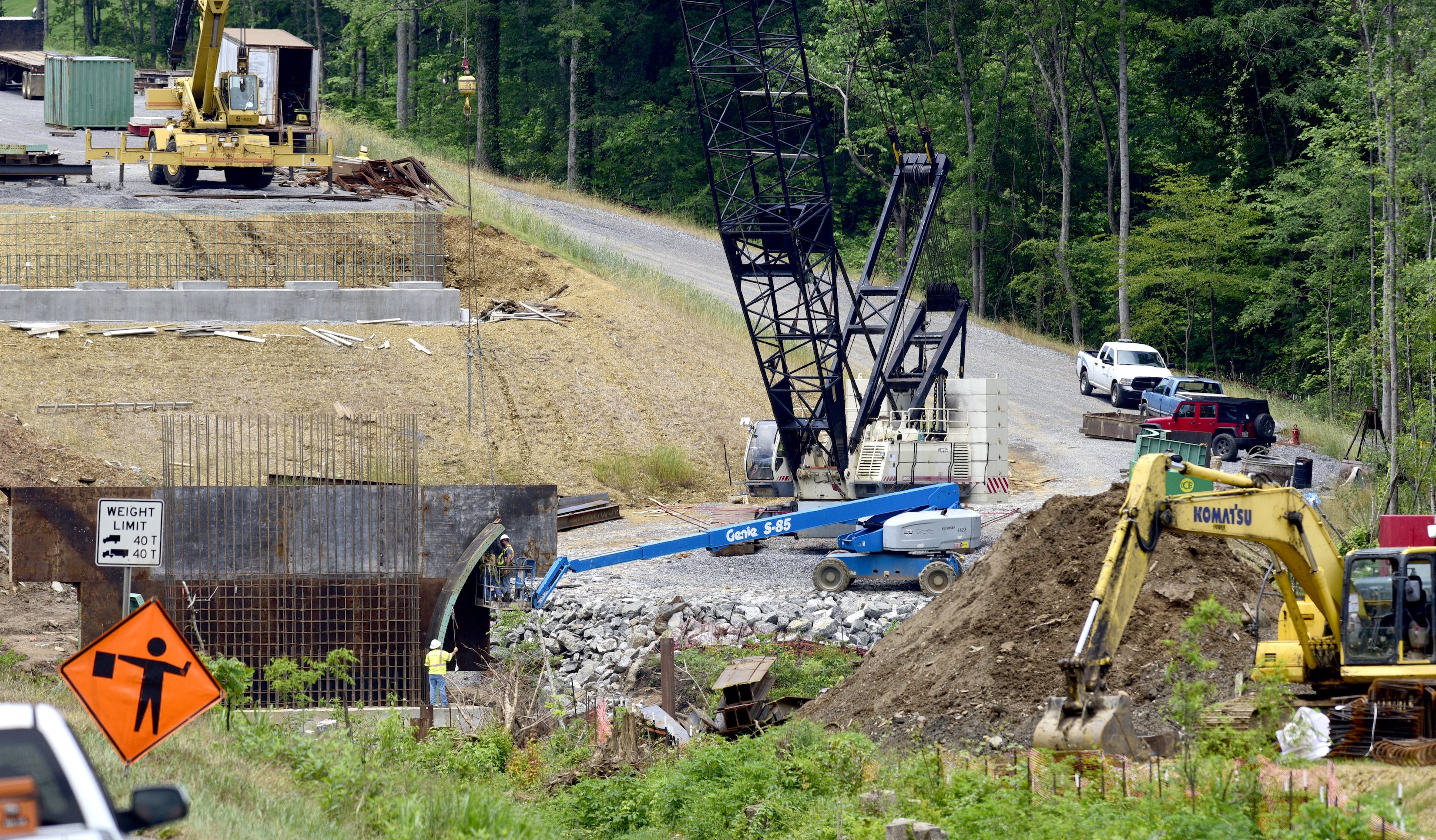 Staff Photo by Robin Rudd / Contractor Charles Blalock and Sons, Inc. contiunes on the State Route-40 (US-64) bridge over the Ocoee River on June 4, 2021. The contractor is working on foundations for the new bridge and relocation of utilities Brief intermittent lane closures are possible Monday through Friday 8 AM to 5:30 PM to allow for utility work and moving equipment/supplies.