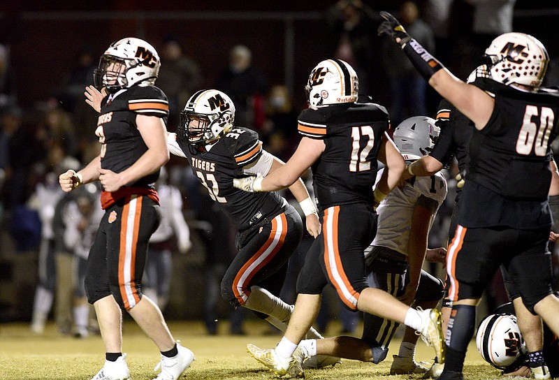 Staff Photo by Robin Rudd /  The Tiger defense celebrates a Rebel turnover.  The Meigs County Tigers host the South Greene Rebels in the quarterfinals of the TSSAA football playoff on November 20, 2020.  