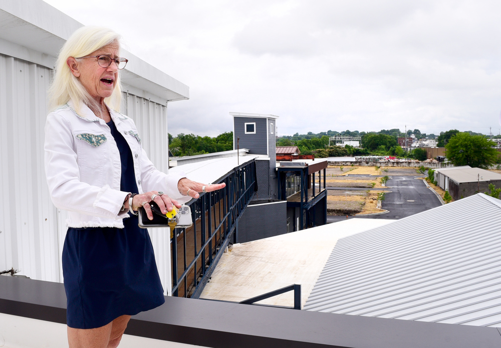 Staff Photo by Robin Rudd / On the roof of the Burnside, Dede Engsberg talks about the multiple uses of the facility and it's role in revitalizing the area. Partners Dede and Towson Engsberg, of SEI Ventures of Tennessee, LLC have teamed with Nathan and Doug Kirkman of DNK Development, LLC to renovate the former Acme Box Company as the Burnside. The Burnside, located at 2100 Rossville Avenue will feature apartments, a restaurant, offices, and retail spaces.