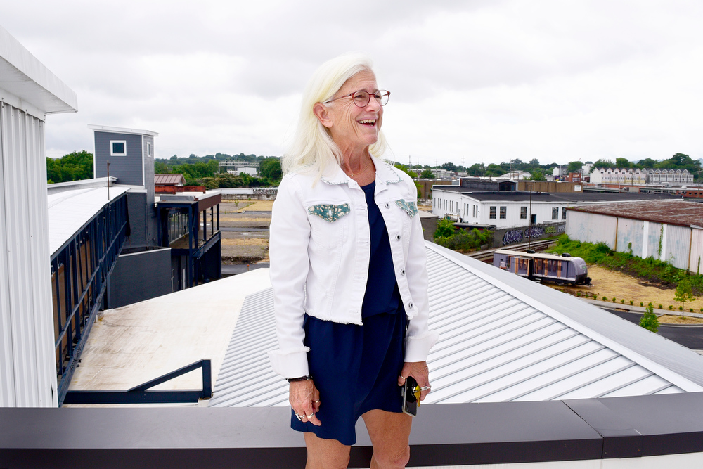 Staff Photo by Robin Rudd / On the roof of the Burnside, Dede Engsberg talks about the multiple uses of the facility and it's role in revitalizing the area. Partners Dede and Towson Engsberg, of SEI Ventures of Tennessee, LLC have teamed with Nathan and Doug Kirkman of DNK Development, LLC to renovate the former Acme Box Company as the Burnside. The Burnside, located at 2100 Rossville Avenue will feature apartments, a restaurant, offices, and retail spaces.