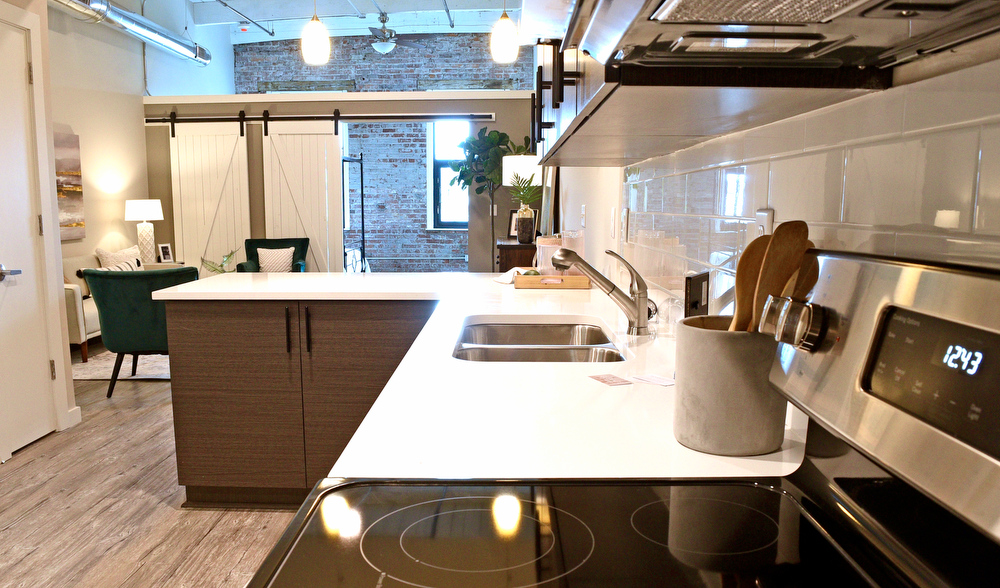Staff Photo by Robin Rudd / Shown is the kitchen area of one of the apartments at the Burnside. Partners Dede and Towson Engsberg, of SEI Ventures of Tennessee, LLC have teamed with Nathan and Doug Kirkman of DNK Development, LLC to renovate the former Acme Box Company as the Burnside. The Burnside, located at 2100 Rossville Avenue will feature apartments, a restaurant, offices, and retail spaces.