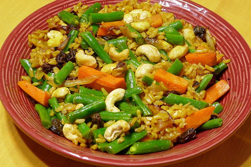 Cashew and Vegetable Pilaf uses microwaveable brown rice as a time-saver. / Photo by Linda Gassenheimer/TNS