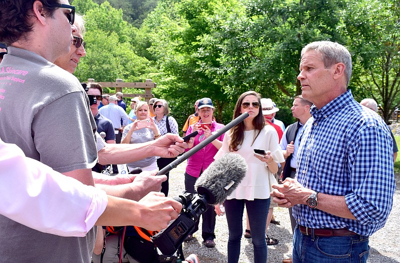 Staff Photo by Robin Rudd / Tennessee Governor Bill Lee listens to reporter's questions during a press availability at the Middle Put-in on the Ocoee River. Tennessee Governor Bill Lee visited the Ocoee River, on June 4, 2021, to celebrate the impact of tourism and also in celebration of the state's 225th birthday.