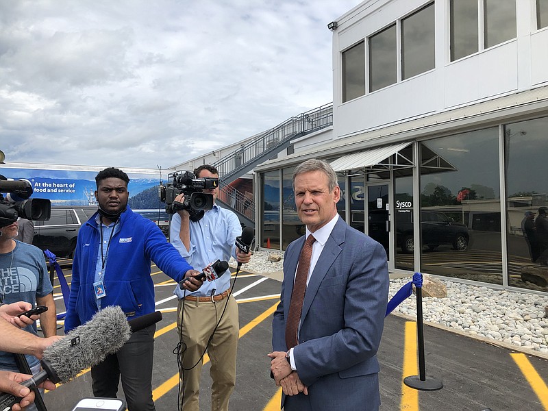 Tennessee Gov. Bill Lee speaks with reporters Tuesday, June 8, following an event at wholesale restaurant food supplier Sysco Nashville. (Photo by Andy Sher/Chattanooga Times Free Press.)