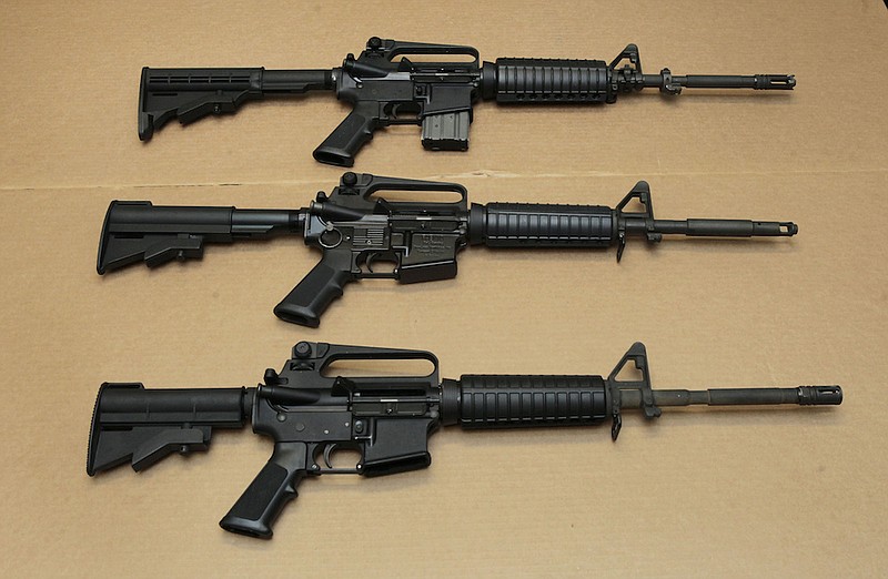 In this Aug. 15, 2012, file photo, three variations of the AR-15 assault rifle are displayed at the California Department of Justice in Sacramento, Calif. (AP Photo/Rich Pedroncelli, File)