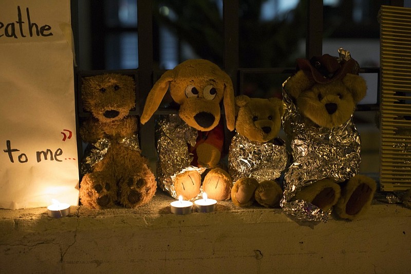 FILE - In this Wednesday, June 20, 2018, file photo, stuffed toy animals wrapped in aluminum foil representing migrant children separated from their families are displayed in protest in front of the United States embassy in Guatemala City. In a report released Tuesday, June 8, 2021, the Biden administration says it has identified more than 3,900 children separated at the border under former President Donald Trump's 'zero-tolerance' policy on illegal crossings. (AP Photo/Luis Soto, File)