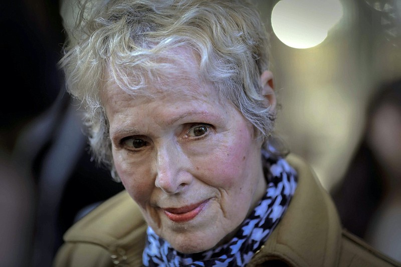 FILE - In this March 4, 2020, file photo, E. Jean Carroll talks to reporters outside a courthouse in New York. On Monday, June 7, 2021, Justice Department lawyers said former President Donald Trump cannot be held personally liable for "crude and disrespectful" remarks he made while president about Carroll, who accused him of rape. (AP Photo/Seth Wenig, File)