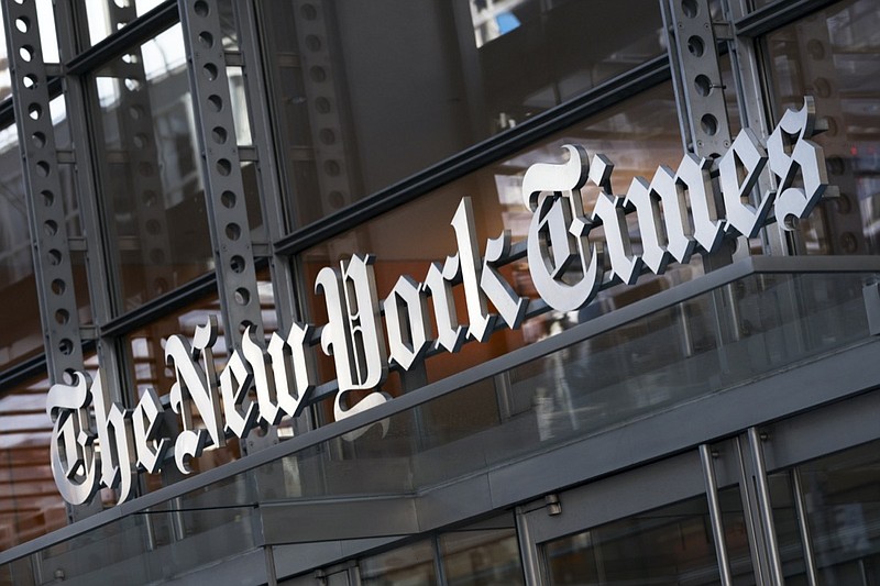 FILE - In this Thursday, May 6, 2021 file photo, a sign for The New York Times hangs above the entrance to its building, in New York. Numerous websites were unavailable on Tuesday June 8, 2021, after an apparent widespread outage at cloud service company Fastly. Dozens of high-traffic websites including the New York Times, CNN, Twitch and the U.K. government's home page, could not be reached. (AP Photo/Mark Lennihan, File)

