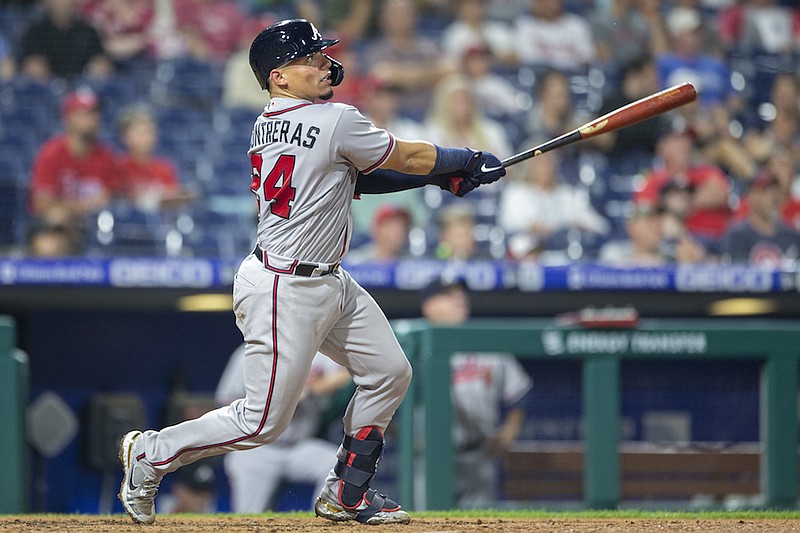 Atlanta Braves' William Contreras watches the ball after hitting a home run during the fourth inning of a baseball game against the Philadelphia Phillies, Tuesday, June 8, 2021, in Philadelphia. (AP Photo/Laurence Kesterson)