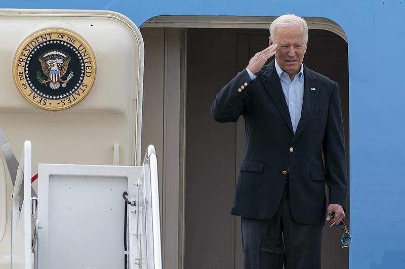 President Joe Biden salutes as he boards Air Force One upon departure, Wednesday, June 9, 2021, at Andrews Air Force Base, Md. (AP Photo/Alex Brandon)


