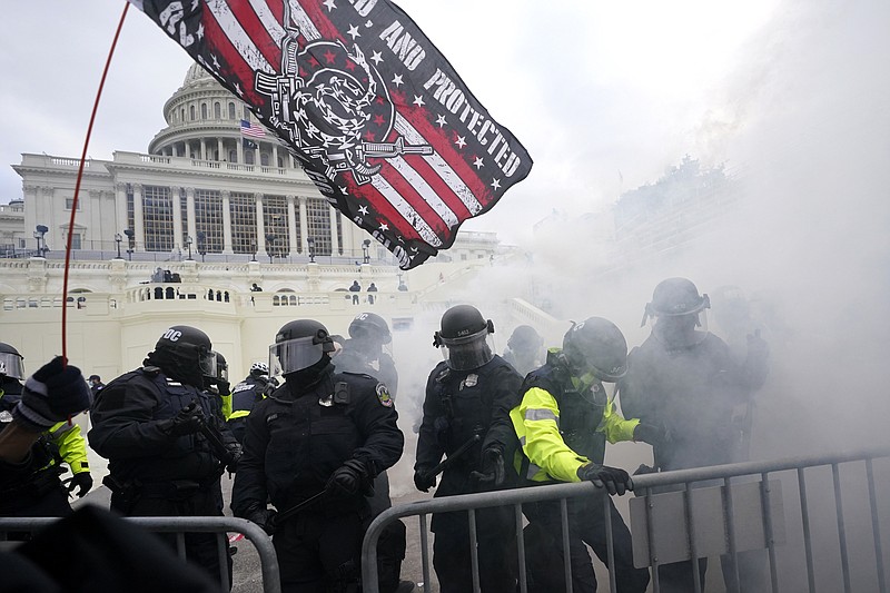 Associated Press file photo / In this Jan. 6, 2021, file photo, U.S. Capitol Police officers hold off rioters loyal to President Donald Trump at the Capitol in Washington.