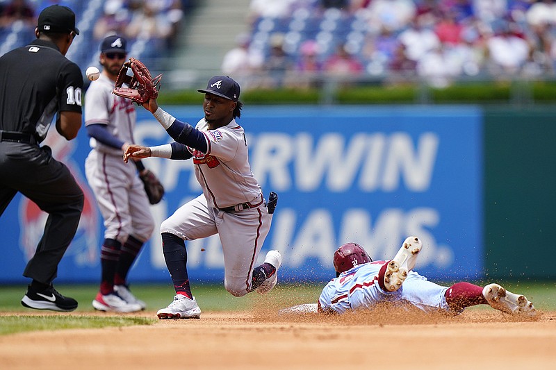 AP photo by Matt Slocum / The Philadelphia Phillies' Odubel Herrera steals second base as the Atlanta Braves' Ozzie Albies stretches for the late throw during Thursday's game. The host Phillies won 4-3 in 10 innings when Herrera was safe at home on Jean Segura's hit.