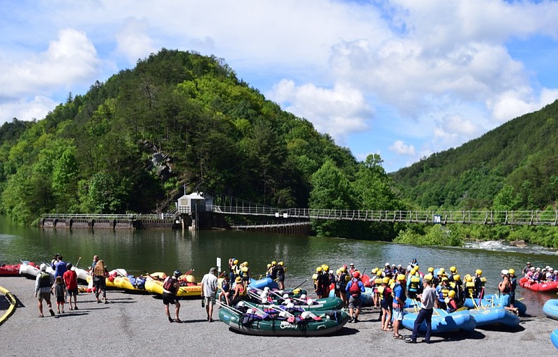 Paddlers and rafts line the pool above the put-in on the Ocoee River.  Tennessee Governor Bill Lee visited the Ocoee River, on June 4, 2021, to celebrate the impact of tourism and also in celebration of the state's 225th birthday. / Staff Photo by Robin Rudd 