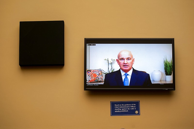 In this May 19, 2021 file photo, Robert Kramer, President and Chief Executive Officer of Emergent BioSolutions, speaks via videoconference during a House Select Subcommittee on the Coronavirus Crisis hearing on Capitol Hill in Washington. U.S. regulators are allowing for the release of 10 million doses of Johnson & Johnson's COVID-19 vaccine from a troubled Baltimore factory, but material to make many more must be thrown out because of possible contamination, a person familiar with the decision told The Associated Press on Friday, June 11. (Stefani Reynolds/The New York Times via AP, Pool, File)