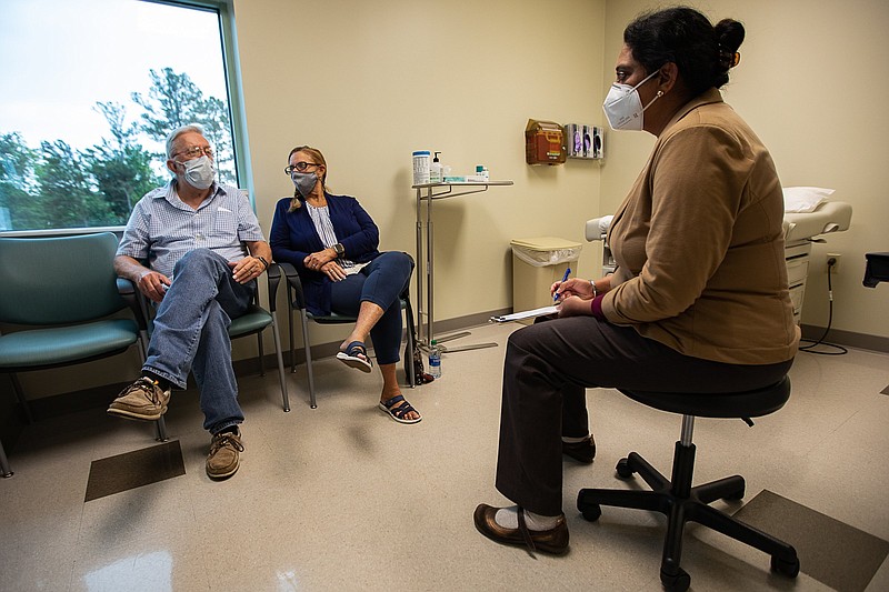 Staff photo by Troy Stolt / Wayne Elder and his daughter Eileen Fitzgerald-Elder speak with Dr. Berneet Kaur at Erlanger East on Friday, June 11, 2021 in Chattanooga, Tenn.