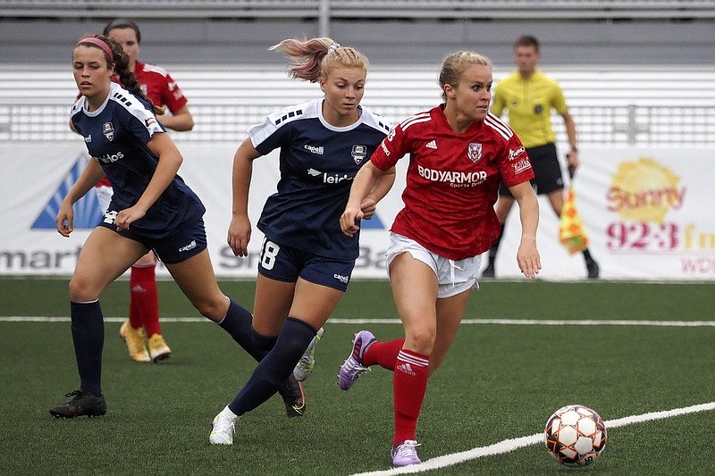 Staff photo / Chattanooga Lady Red Wolves forward Summer Hernandez controls the ball during a home match against North Alabama Soccer Coalition last Sunday at CHI Memorial Stadium. Hernandez, who works as a surgical nurse for CHI Memorial Hospital, has been married to Chattanooga Football Club midfielder Juan Hernandez since April 2020.