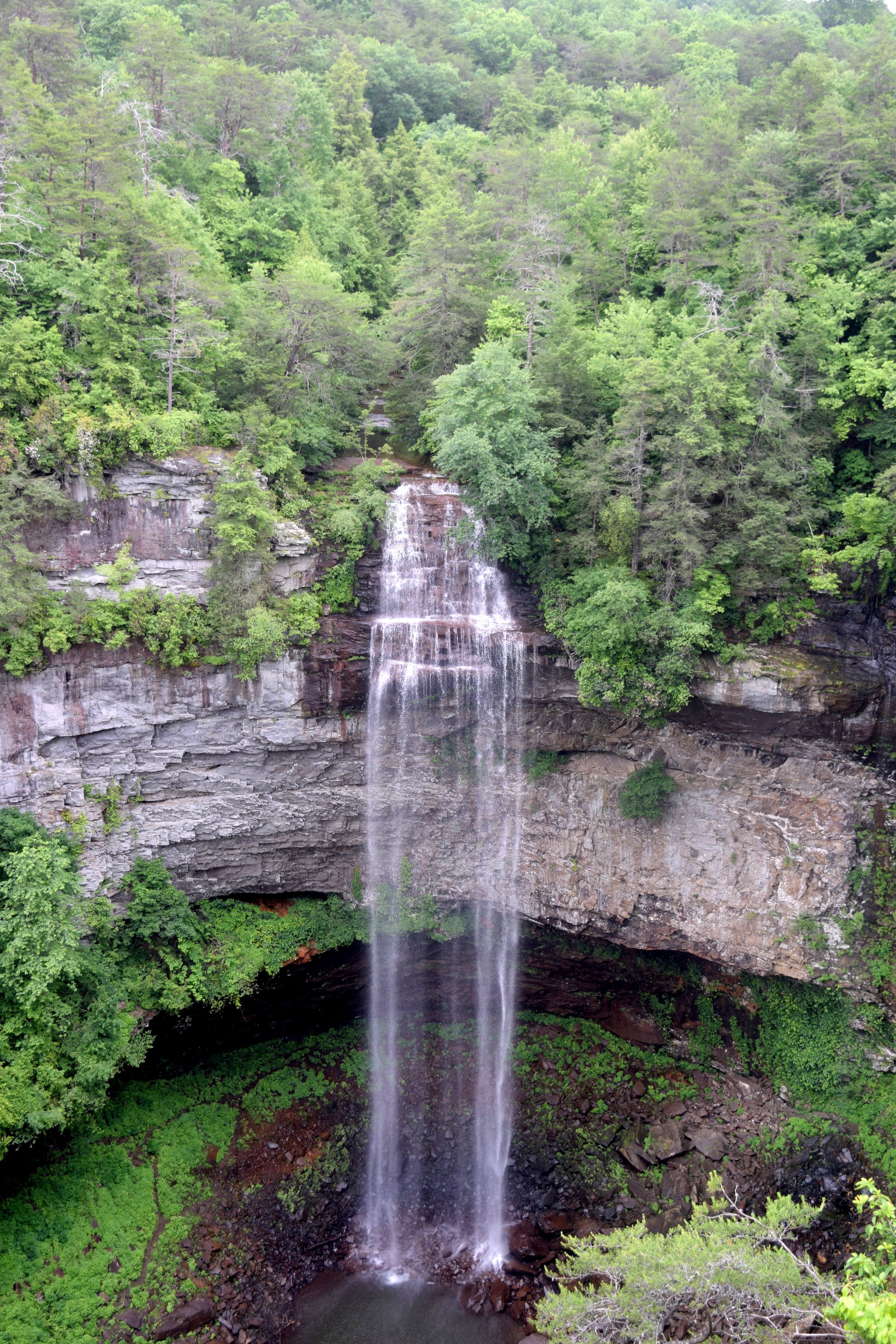 Staff photo by Ben Benton / At 256 feet, the namesake for Fall Creek Falls State Park, Fall Creek Falls, is the highest waterfall east of the Mississippi River. Here, the falls flow after morning showers on June 9, 2021.