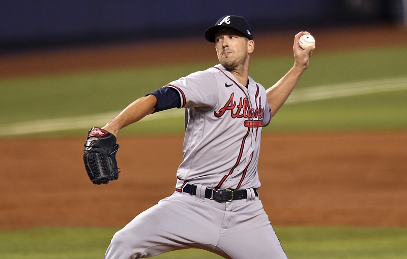 AP photo by Jim Rassol / Drew Smyly pitches for the Atlanta Braves during the first inning of Sunday's game in Miami. Smyly earned the win on his 32nd birthday as the Braves beat the Marlins 6-4 to end a four-game losing streak.