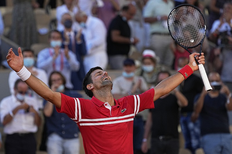 AP photo by Michel Euler / Novak Djokovic celebrates after beating Stefanos Tsitsipas on Sunday to win the French Open for the second time and earn his 19th major championship, one shy of the men's singles record shared by Big Three rivals Roger Federer and Rafael Nadal.