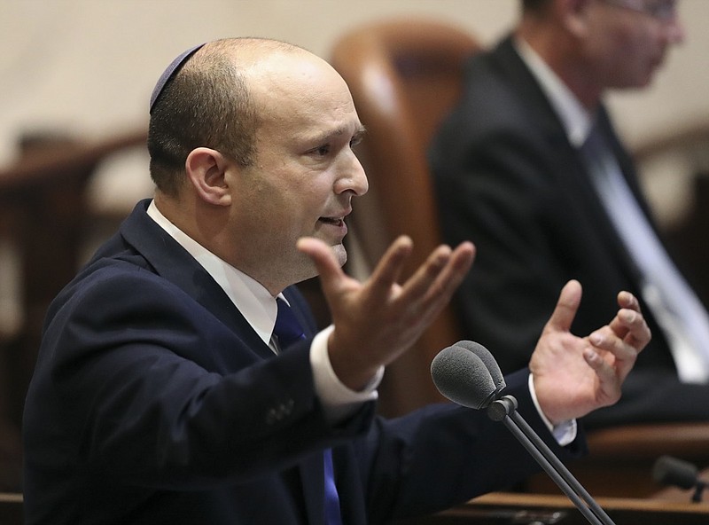 Israel's designated new prime minister, Naftali Bennett speaks during a Knesset session in Jerusalem Sunday, June 13, 2021. Bennett is expected later Sunday to be sworn in as the country's new prime minister, ending Prime Minister Benjamin Netanyahu's 12-year rule. (AP Photo/Ariel Schali22