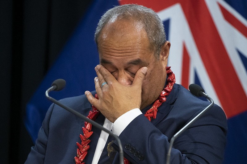Pacific Peoples Minister Aupito William Sio reacts while talking about his personal experiences of the 1970's dawn raids during a post-Cabinet press conference at Parliament in Wellington, New Zealand, Monday, June 14, 2021. New Zealand's government is formally apologizing for an immigration crackdown nearly 50 years ago in which Pacific people were targeted for deportation, often after early-morning home raids. (Mark Mitchell/NZ Herald via AP)