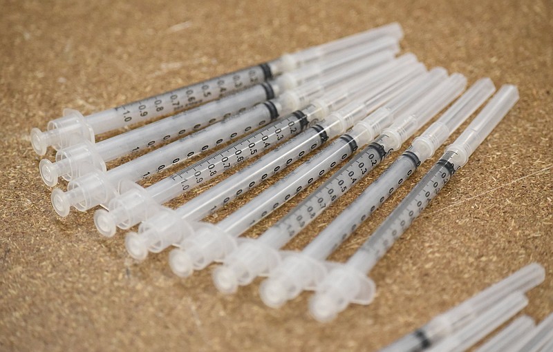 Staff Photo by Matt Hamilton / Syringes are lined up to be filled with vaccine at the Howard School in Chattanooga on Saturday April 24, 2021.