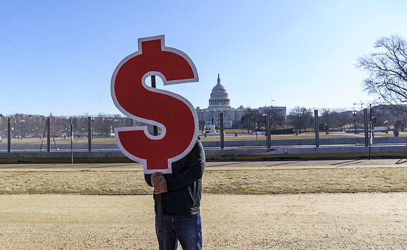 Photo by Scott Applewhite of The Associated Press / Activists appeal for a $15 minimum wage near the Capitol in Washington on Thursday, Feb. 25, 2021.